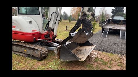 skid steer attachment storage|bucket buddy for mini excavator.